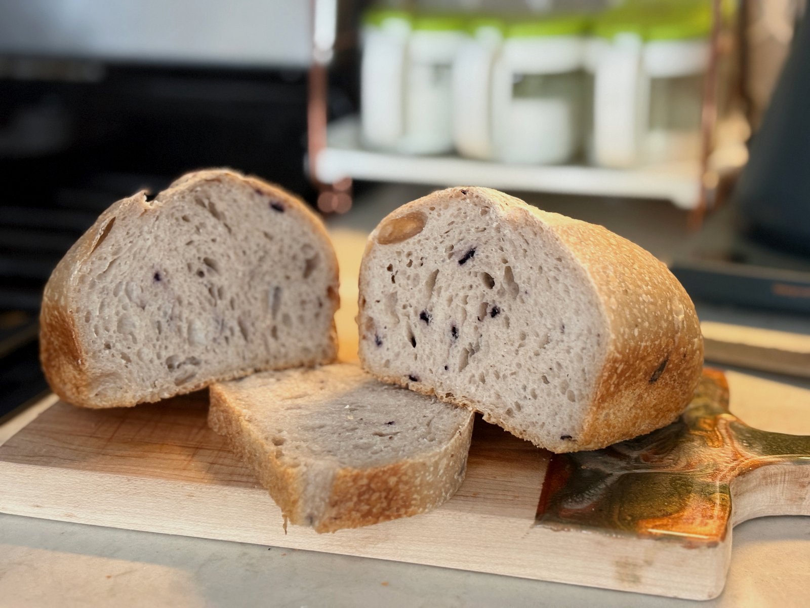 Sliced berry sandwich loaf with golden crust and berry-speckled crumb